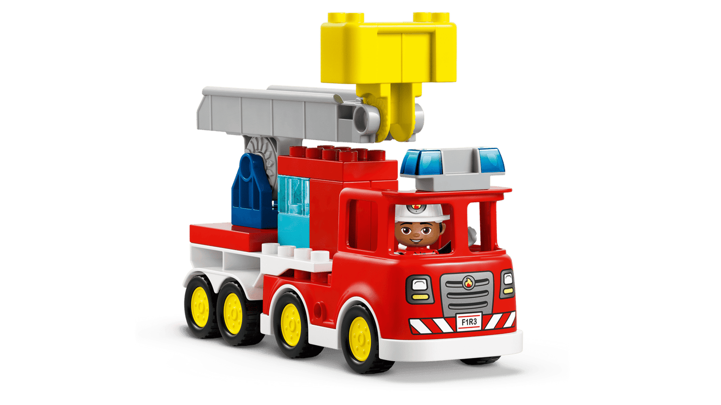 Fire Truck With Hose And Firefighter
